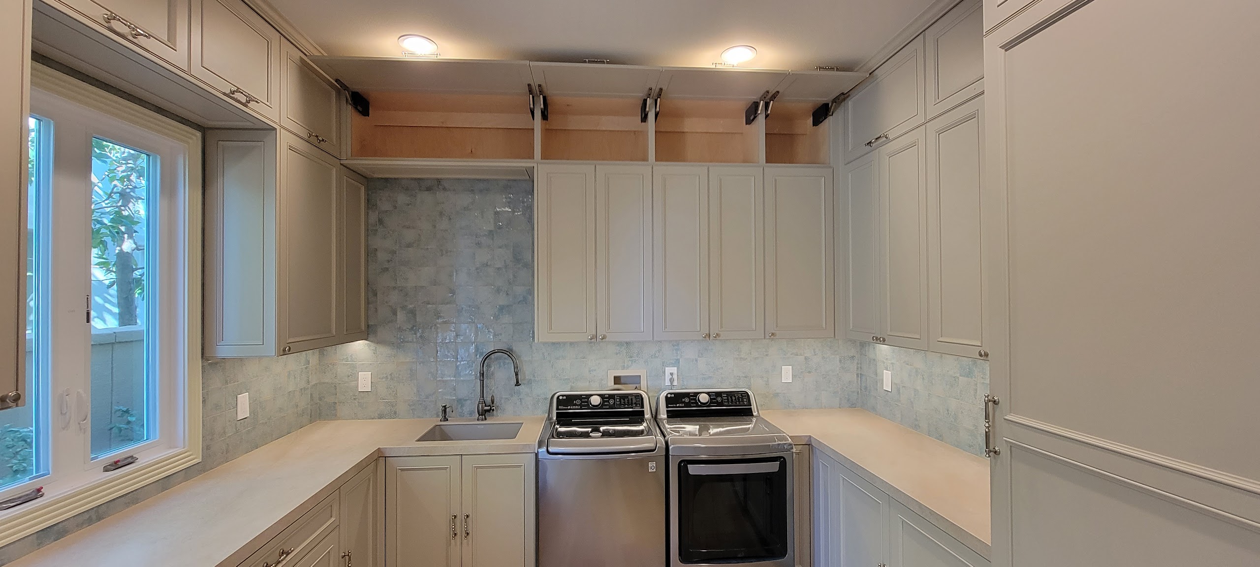 Luxury Laundry Room with Custom Cabinetry